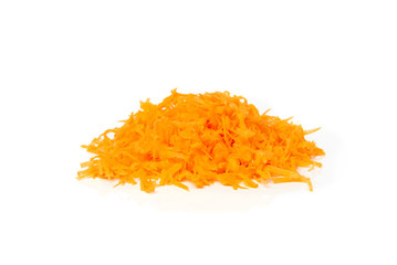 Fresh grated carrot isolated on white background.