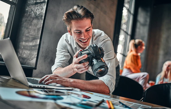 Young cheerful photographer