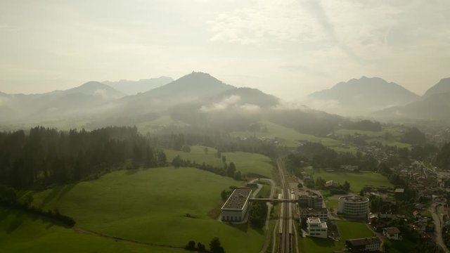 birdview in the austrian alps in fieberbrunn with railway station