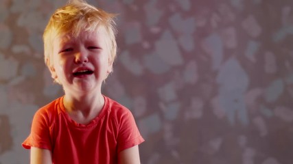 Father scolds child, shows tight fist and wants to punish him. Baby in red t-shirt is crying. Boy showing stop gesture with his hand. concept of domestic violence and child abuse. Unhappy childhood