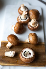 Fresh raw royal champignon on marble board
