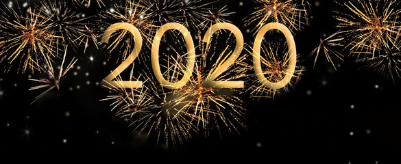 year 2020 golden number on bright firework in the night