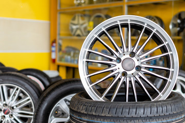 Alloy car wheels and pneumatic tires in store or service center