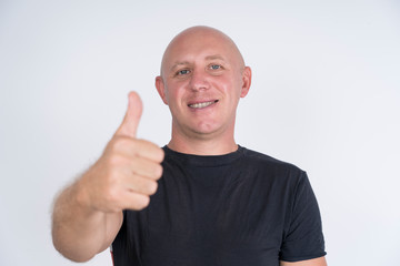 Portrait of an happy bald man, indoors, close up