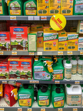 Paris, France - April 27, 2019 : Shelves with a variety of Herbicides in a french Hypermarket. Roundup is a brand-name of an herbicide containing glyphosate, made by Monsanto Company.