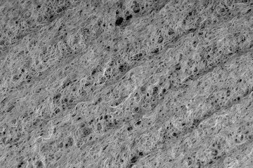 Household cleaning sponges closeup. Sponge detail texture, sponge texture close up background. Cellulose sponge texture. Wire mesh on sponge surface background. Black and white