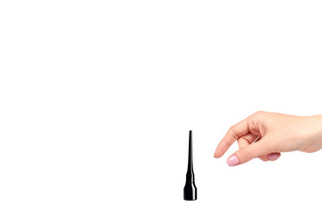 Hand with black liquid pencil, eye makeup brush.