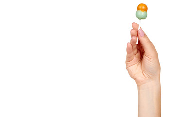 Hand with color lollipop, bright cool candy.