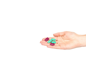 Hand with bright chewing gum, dental bubblegum.