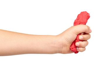 Children hand with color plasticine, kids educational toy.