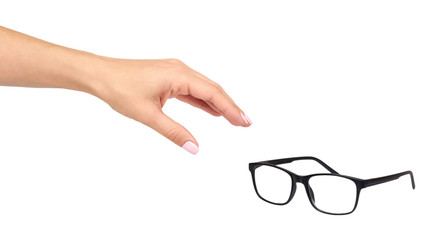 Hand with black eyeglasses, eye optic correction tool.