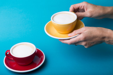 yellow and red cup on a blue background