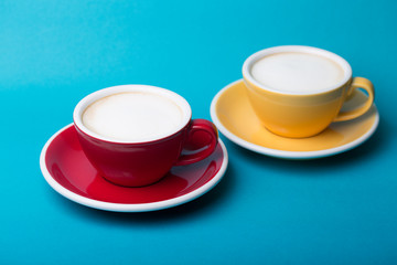 yellow and red cup on a blue background