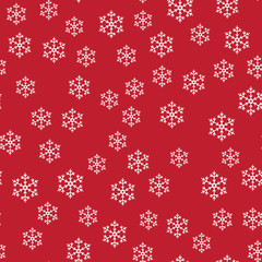 Seamless pattern with white snowflakes on red. Vector