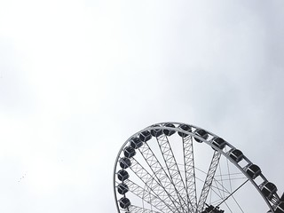 ferris wheel on background of blue sky