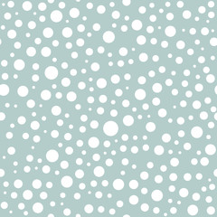 Seamless vector background with random white circles. Abstract light blue and white ornament. Dotted abstract pattern