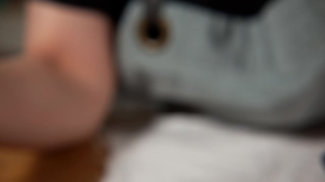 a Japanese female chef removing the stem of Nanko-Ume plums at her home kitchen, Tokyo, Japan. July 2019. Camera fixed, extreme close-up, high view
