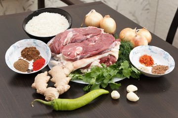 ingredients For cooking goulash or stew: raw meat, herbs, spices, vegetables
