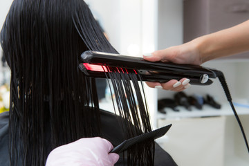 Keratin recovery hair and protein treatment pile with professional ultrasonic iron tool.