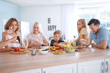 Obraz na płótnie Canvas Big family having dinner at home