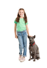 Little girl with cute dog on white background