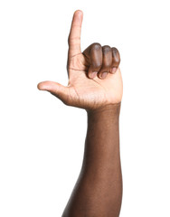 Hand of African-American man pointing at something on white background