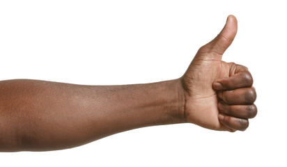 Hand of African-American man showing thumb-up gesture on white background