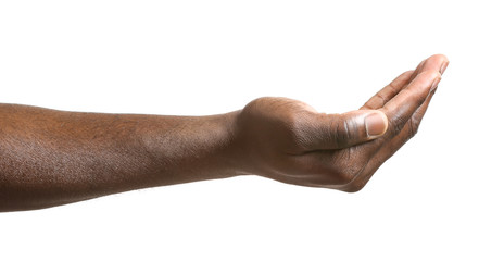 Hand of African-American man holding something on white background