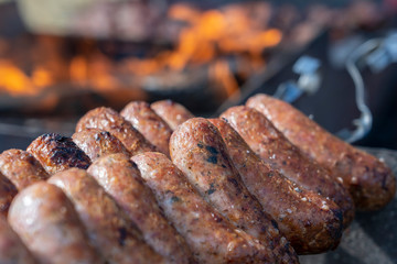 Fried sausages for sell in street food market, Ukraine, closeup