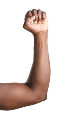 Hand of African-American man with clenched fist on white background