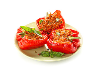 Plate with tasty stuffed pepper on white background