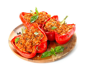 Plate with tasty stuffed pepper on white background