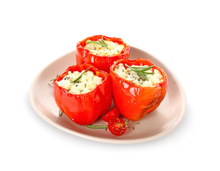 Plate with tasty stuffed pepper on white background