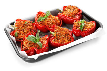 Baking dish with tasty stuffed pepper on white background