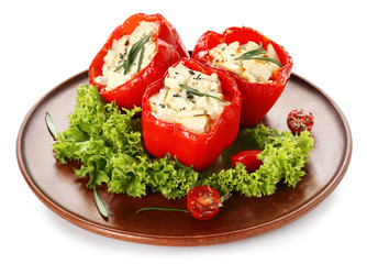 Plate with tasty stuffed pepper on white background