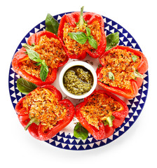 Plate with tasty stuffed pepper and sauce on white background