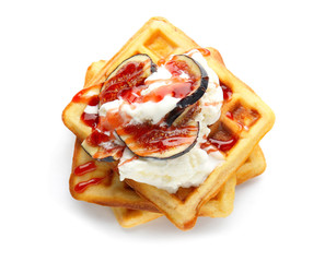 Tasty waffles with fig and ice-cream on white background