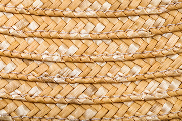 detail of stitched summer straw hat from raffia