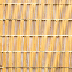 square background of wooden mat woven from sticks