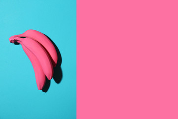 Fototapeta premium Ripe painted bananas on color background