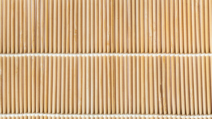 panoramic background of mat from wooden sticks