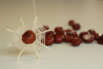 diy creative spinder made from matches, yarns and chestnuts. fun handmade idea for kids in autumn
