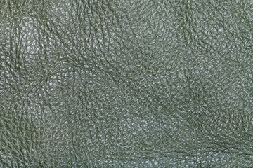 background from dark olive green leather close up