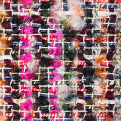 weaving of color threads in boucle fabric close up