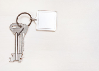 door keys on keyring with blank white keychain