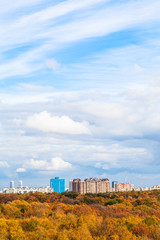 Fototapeta na wymiar white clouds in blue sky over yellow city park