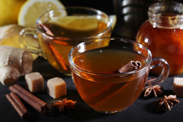 Two glass cups with hot tea with lemon and ginger	