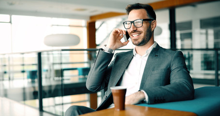 Businessman taking a break with a cup of coffee in office