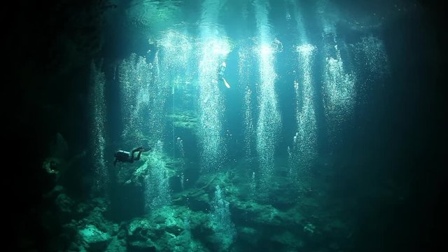 Underwater caves of Yucatan Mexico cenotes. Cave diving in clean and clear underground water.