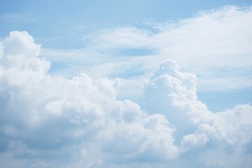 White clouds and blue sky background.